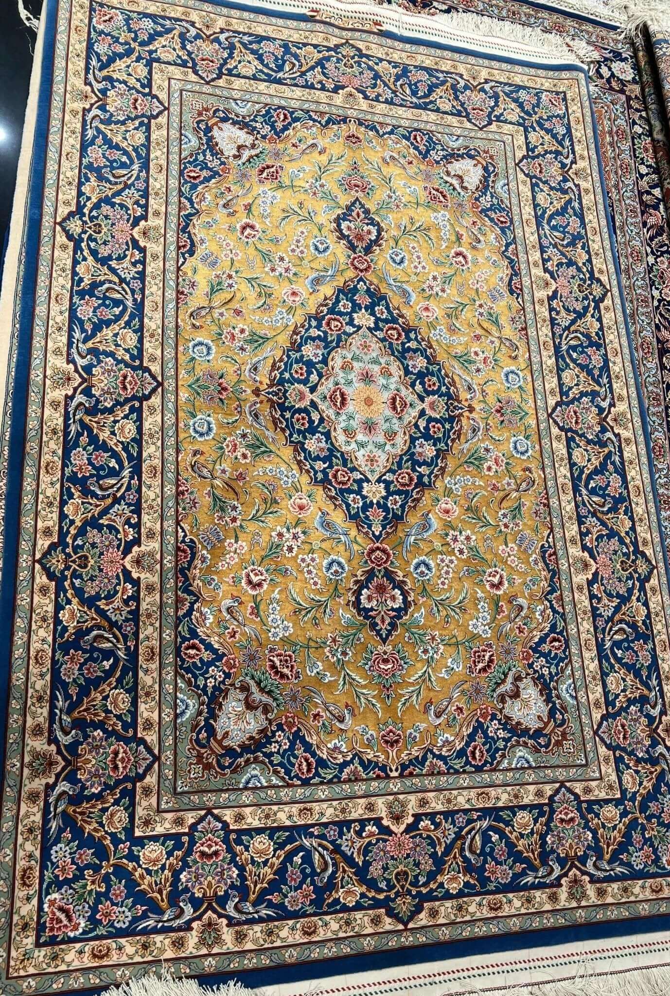 "Persian carpet featuring elegant patterns and superior knot density"